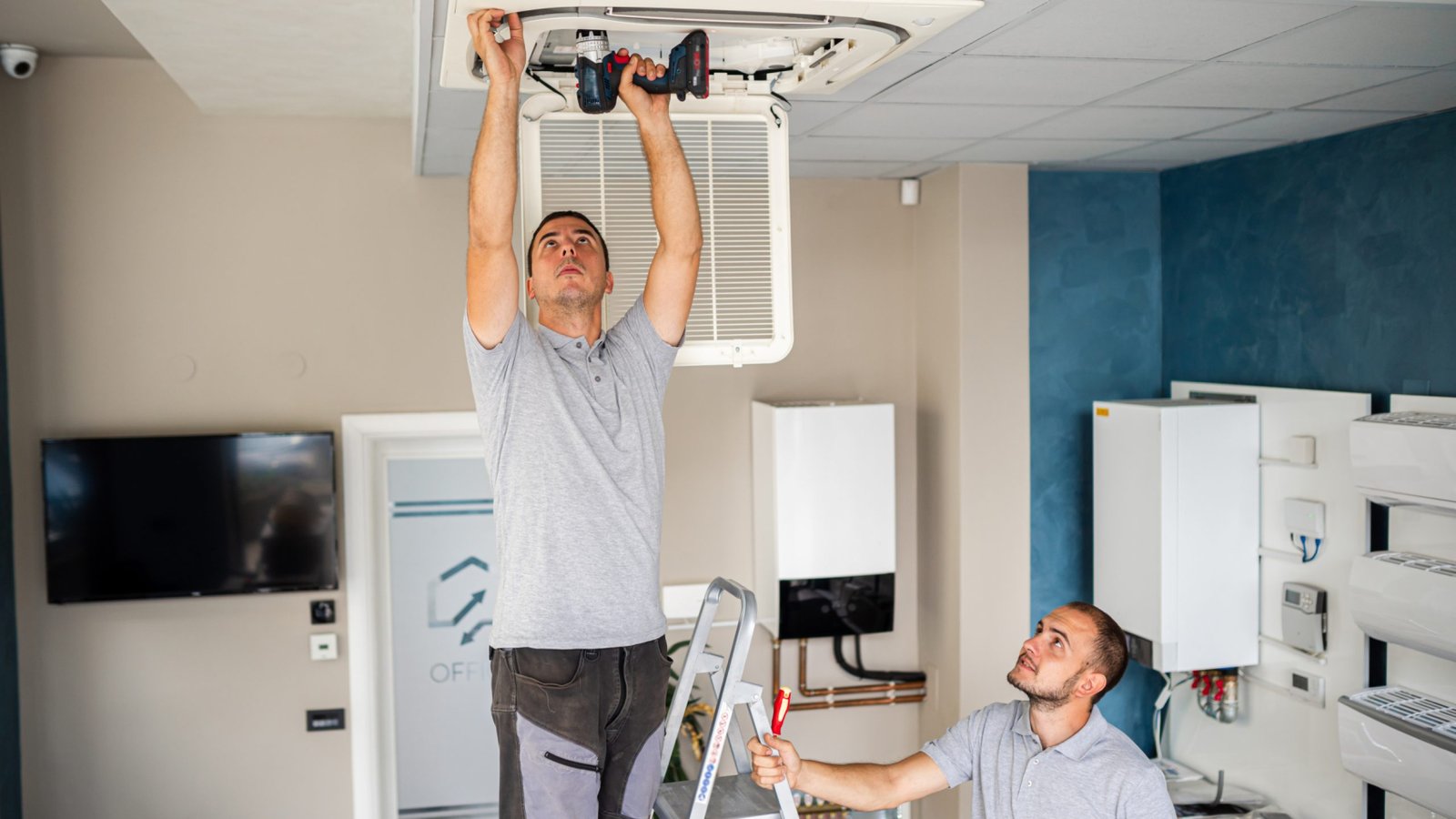 workers install air conditioning workers